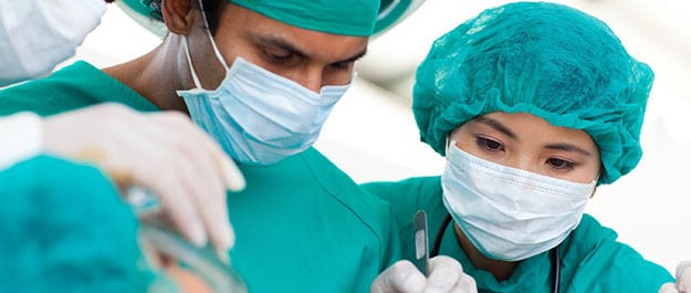 Surgeons-performing-hemorrhoidectomy